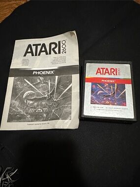 Atari 2600 Phoenix Game Cartridge and Manual - Black & Silver
